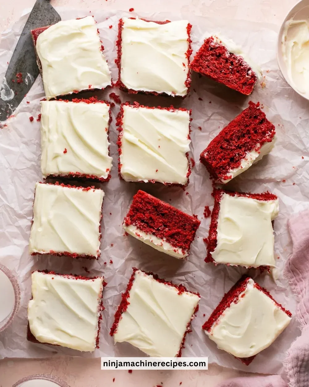 Delicious red velvet cake with cream cheese frosting on a white plate