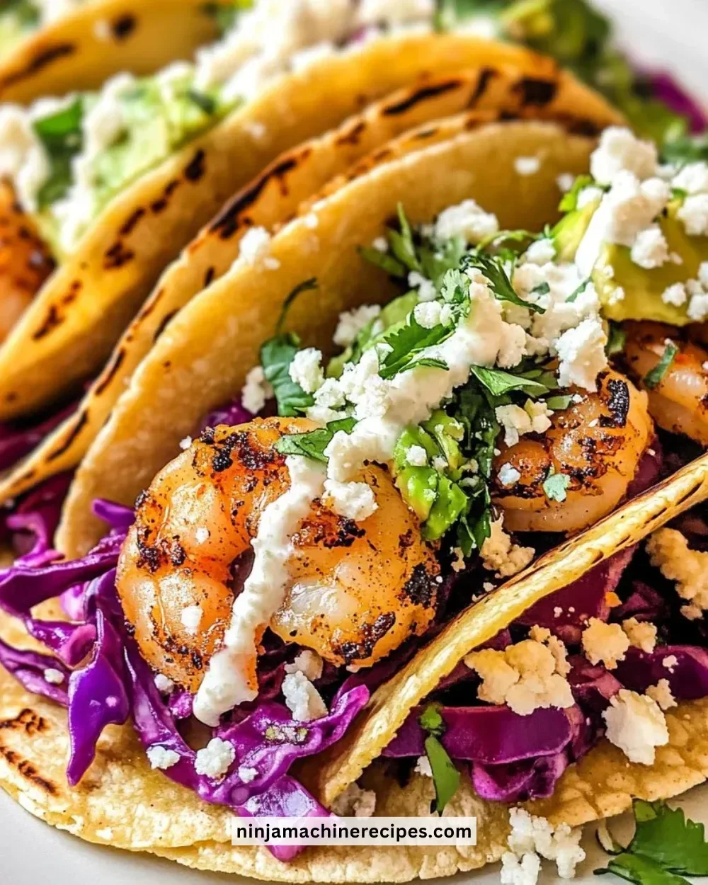 Delicious shrimp tacos topped with fresh ingredients in a vibrant setting.