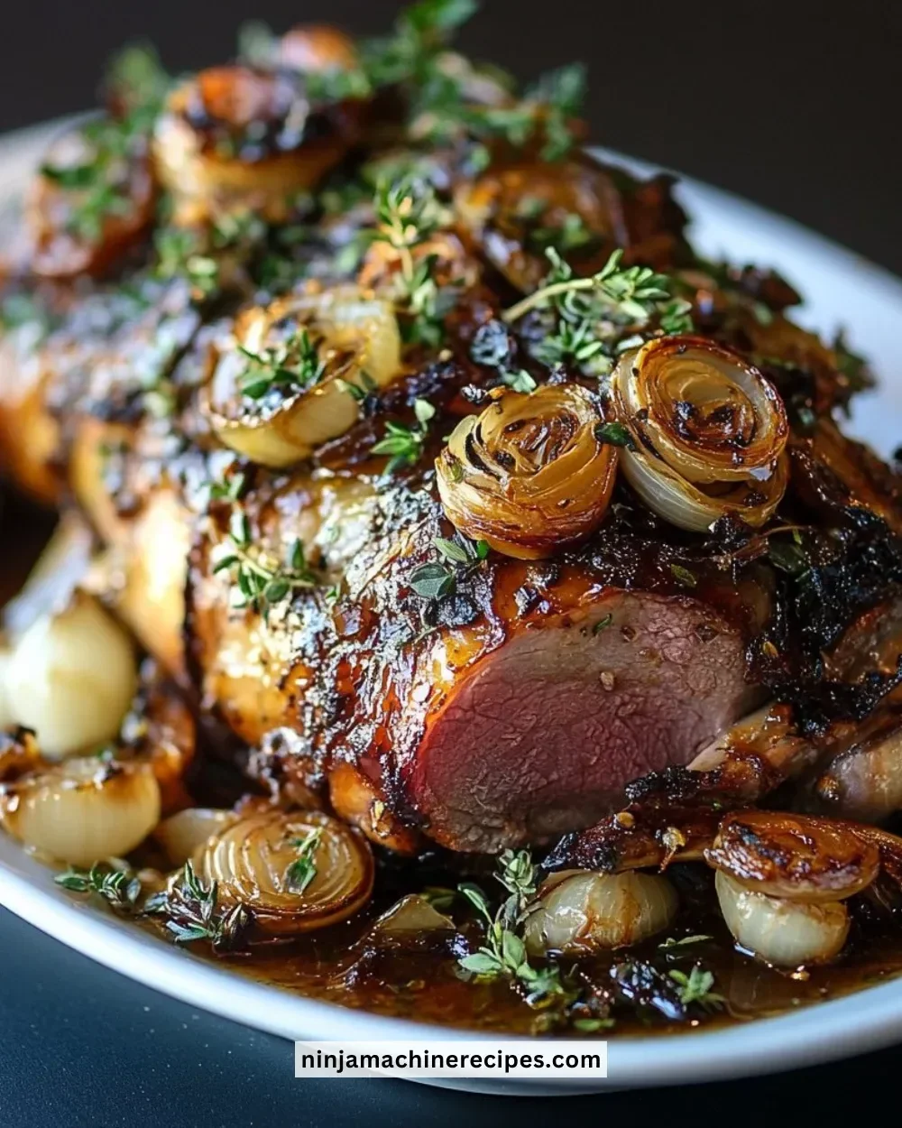 Slow-roasted lamb shoulder with garlic herbs on a rustic cutting board
