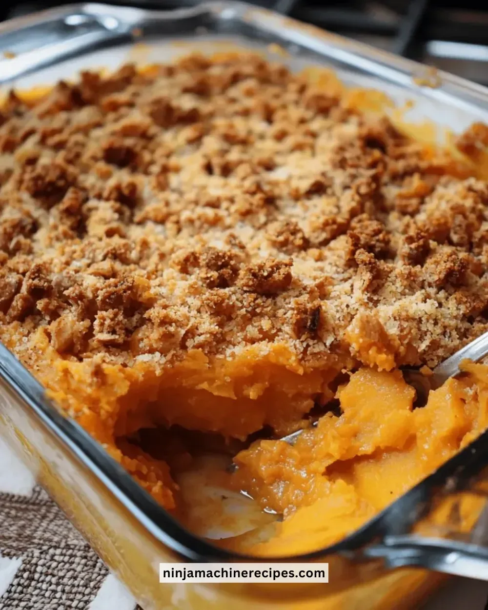 Sweet potato casserole topped with a crunchy pecan and marshmallow topping