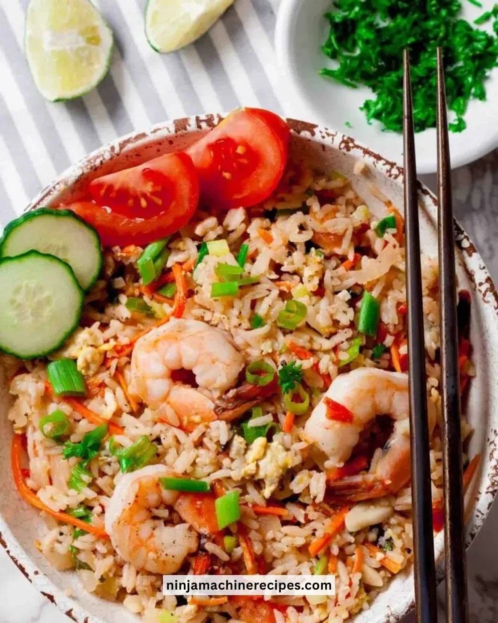 Delicious plate of Thai Fried Rice garnished with vegetables and herbs