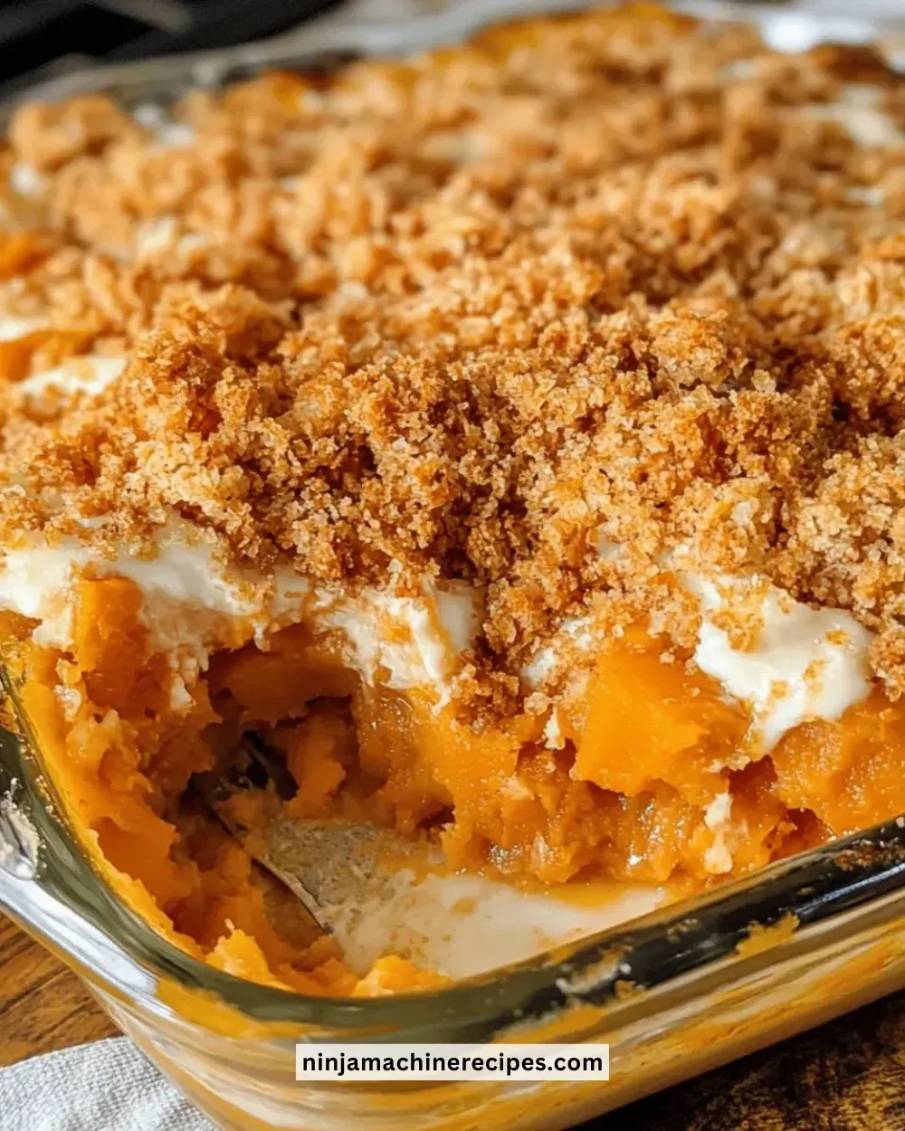 Ultimate sweet potato casserole bake topped with marshmallows and pecans.