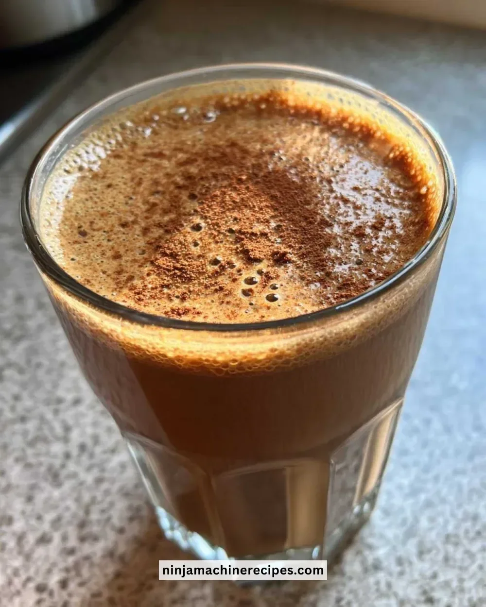 Delicious gingerbread smoothie topped with whipped cream and spices