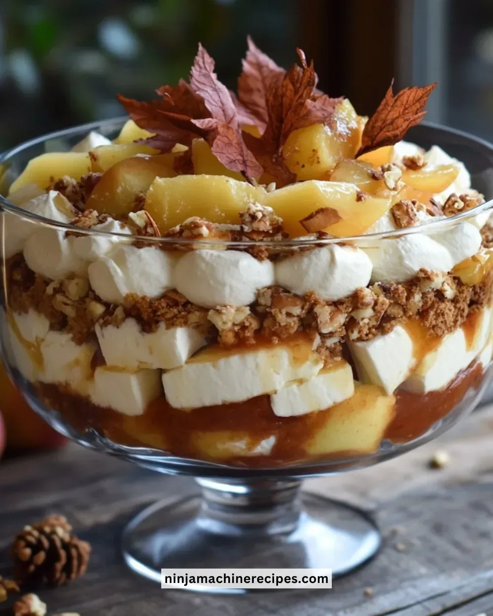 Delicious baked apple caramel trifle with speculoos layers and whipped cream