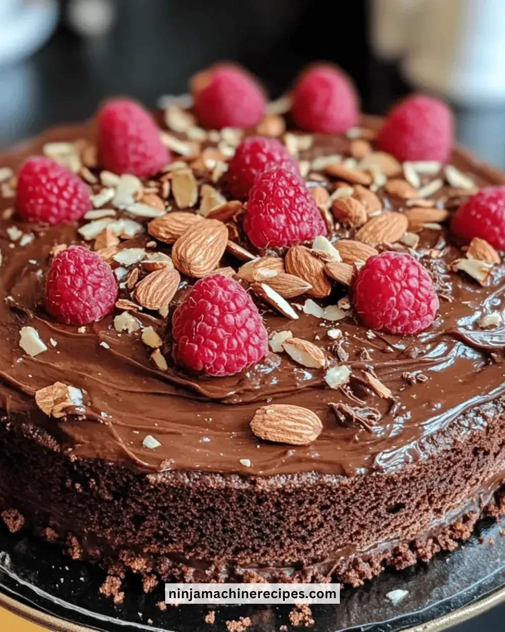 Delicious gluten-free chocolate cake made with almond flour, topped with chocolate frosting