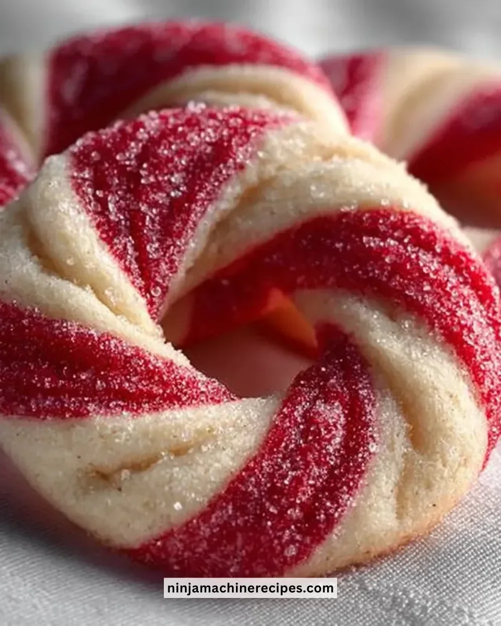 Freshly baked Candy Cane Cookies with vibrant red and white stripes