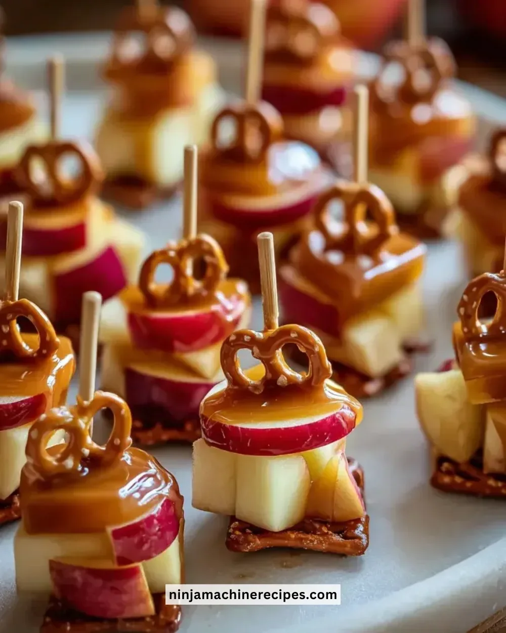 Delicious Caramel Apple Pretzel Bites drizzled with caramel and apple flavor.