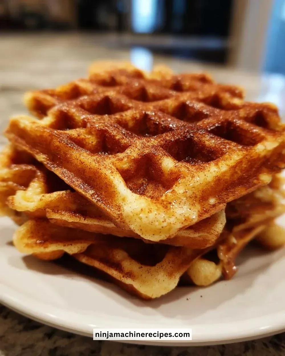 Delicious chai spiced waffles topped with syrup and whipped cream
