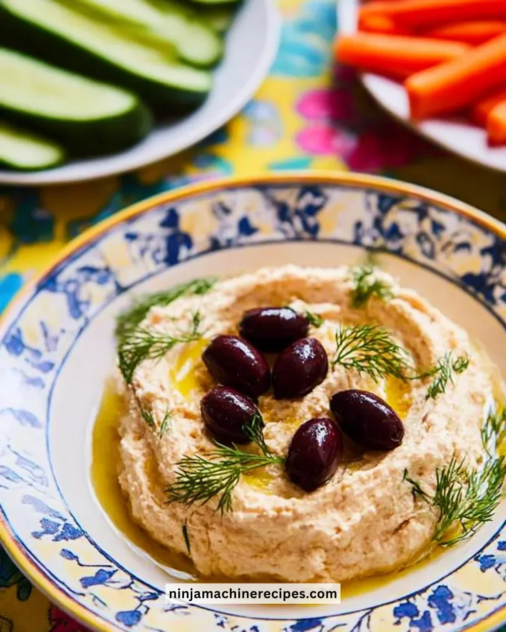 A bowl of tasty cheat's taramasalata with pita and fresh vegetables
