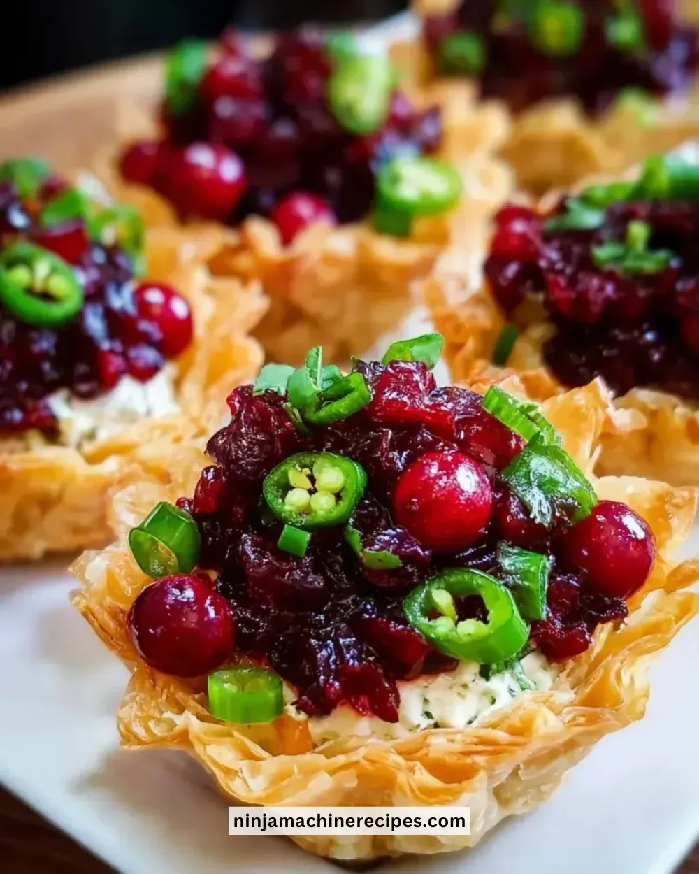 Cranberry Jalapeño Dip Tarts served on a festive platter