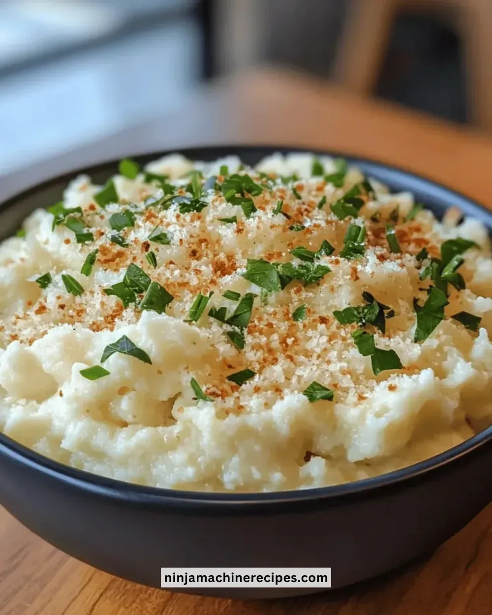 Creamy garlic parmesan mashed cauliflower served in a bowl