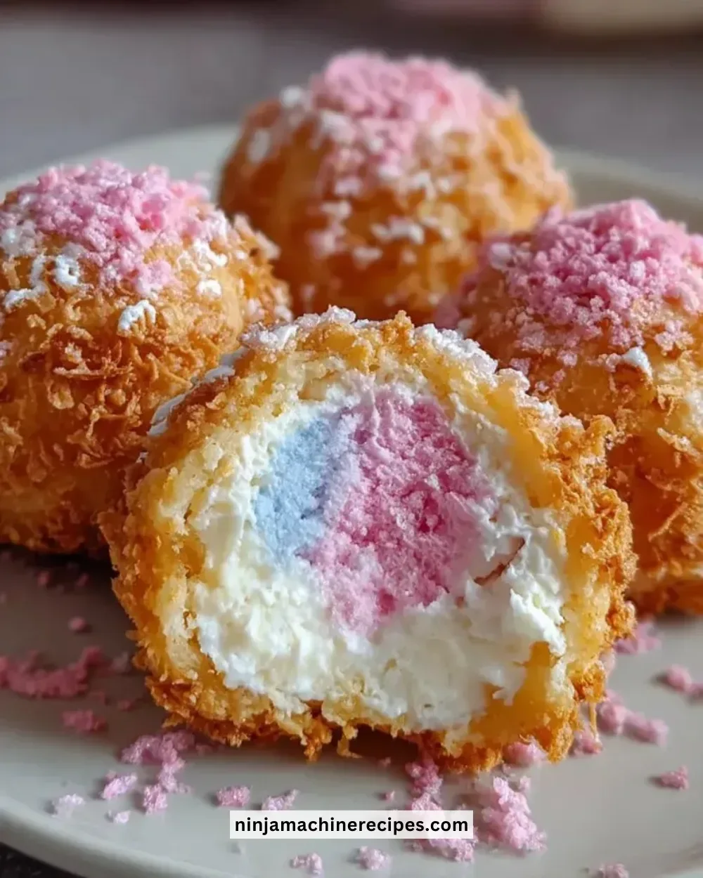 Crispy Cotton Candy Cheesecake Bombs served on a plate