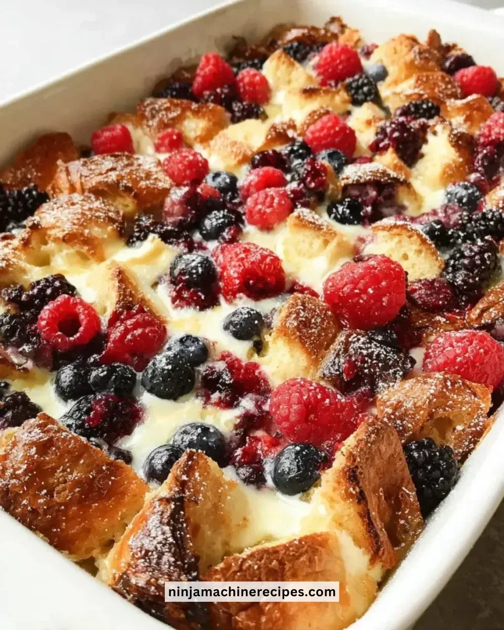 Delicious croissant breakfast casserole served with fresh fruits