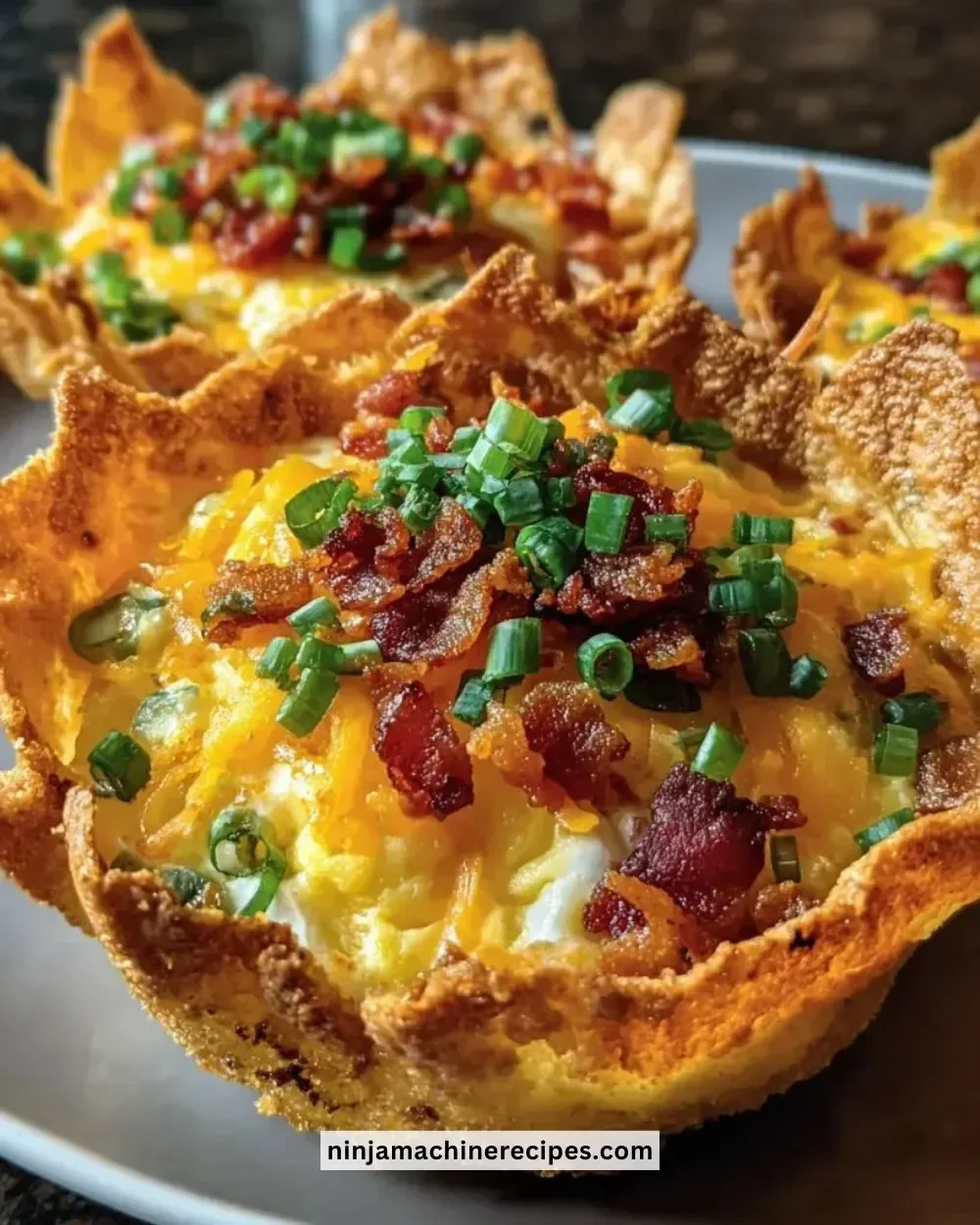 Crunchy tortilla breakfast cups filled with eggs, cheese, and veggies