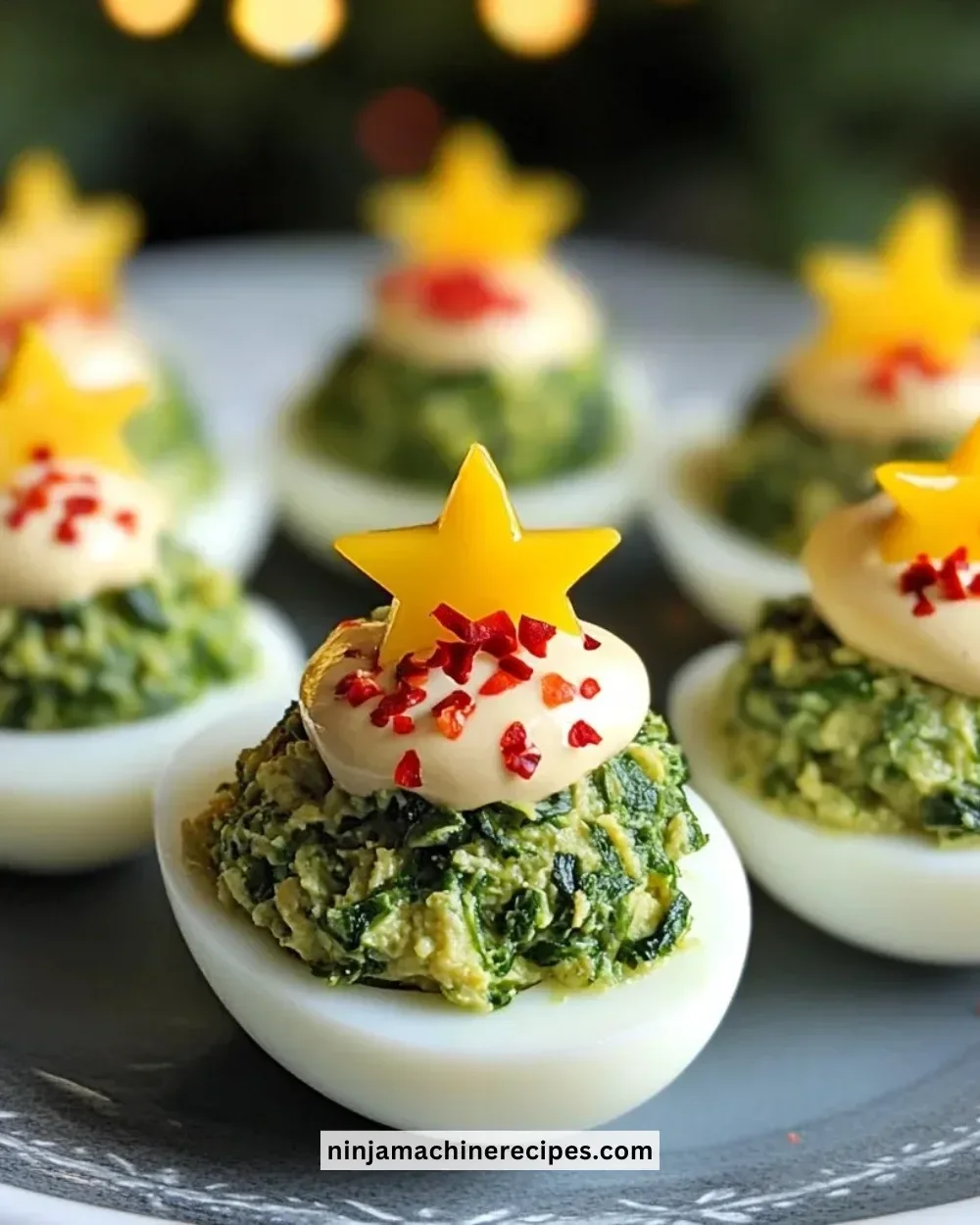 Plate of beautifully garnished deviled eggs ready for serving.