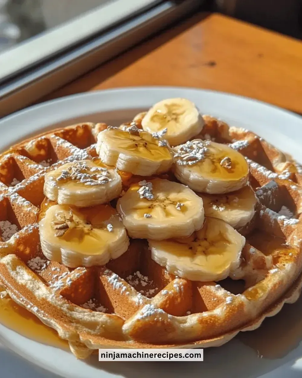 Delicious gluten-free banana oat waffles served with fresh fruit