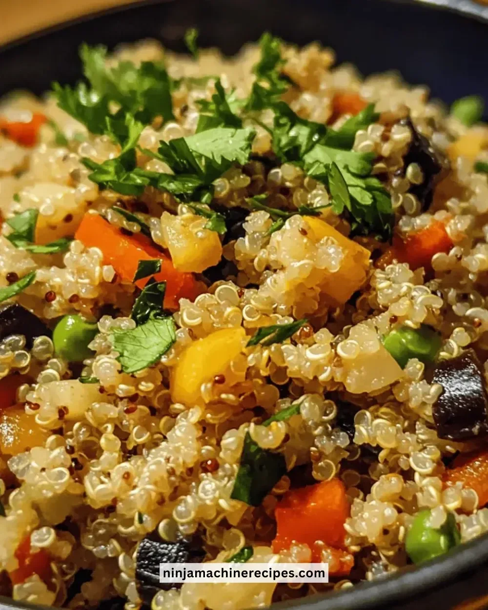 Colorful bowl of gluten-free quinoa pilaf with vegetables