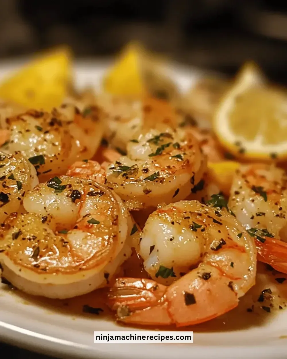 Delicious easy lemon garlic shrimp garnished with herbs on a plate