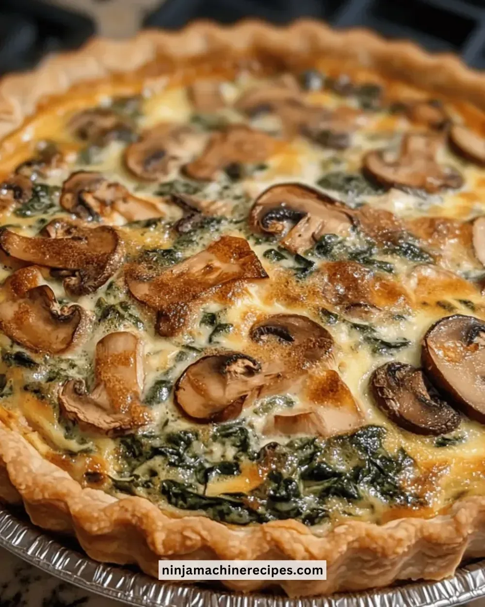 Delicious easy mushroom spinach quiche served on a plate