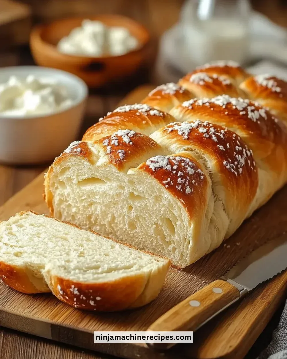 Sliced healthy cottage cheese oat bread on a wooden cutting board