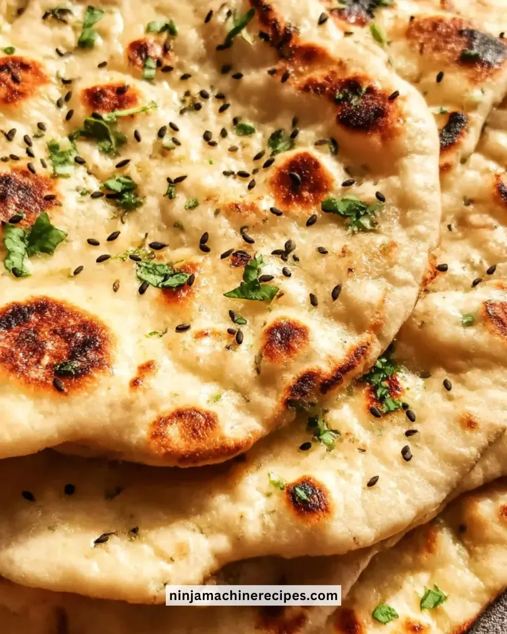 Freshly baked homemade naan bread on a wooden table