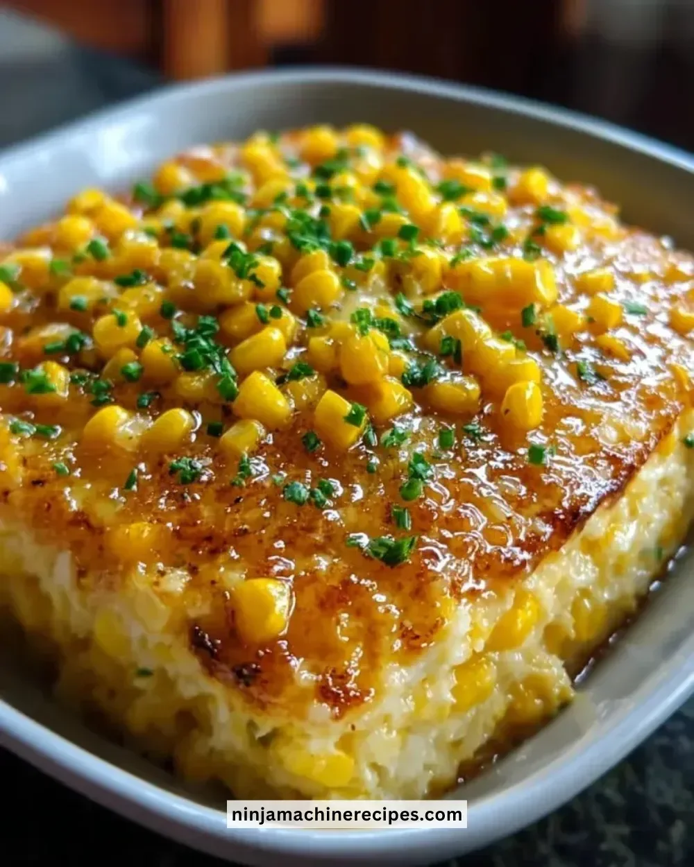 Honey-Glazed Corn Casserole served in a dish with golden brown topping