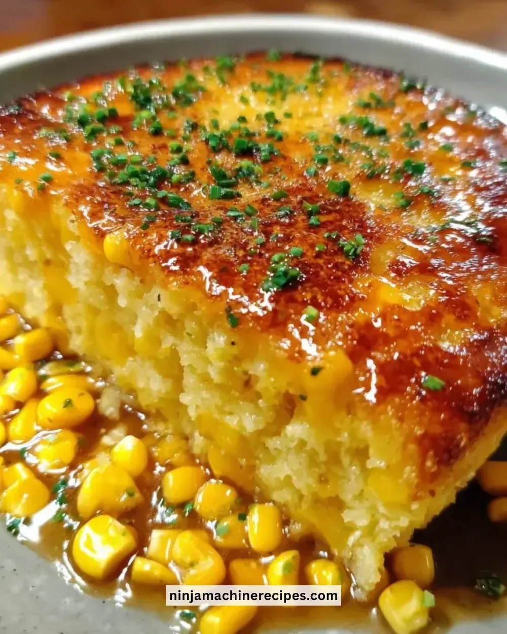 Delicious honey glazed corn casserole served in a baking dish