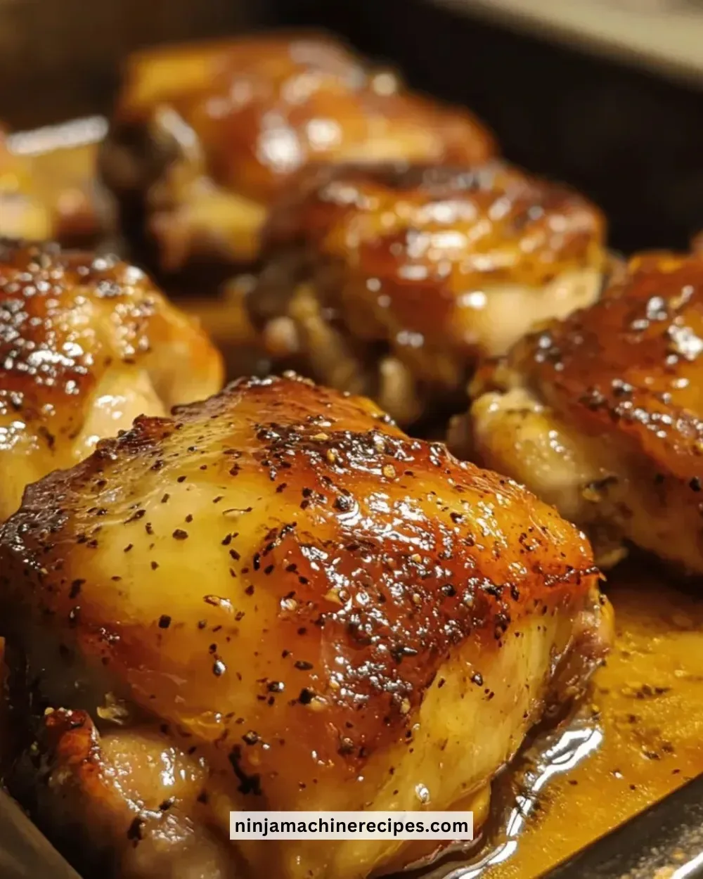 Juicy maple-mustard glazed chicken thighs served on a plate.