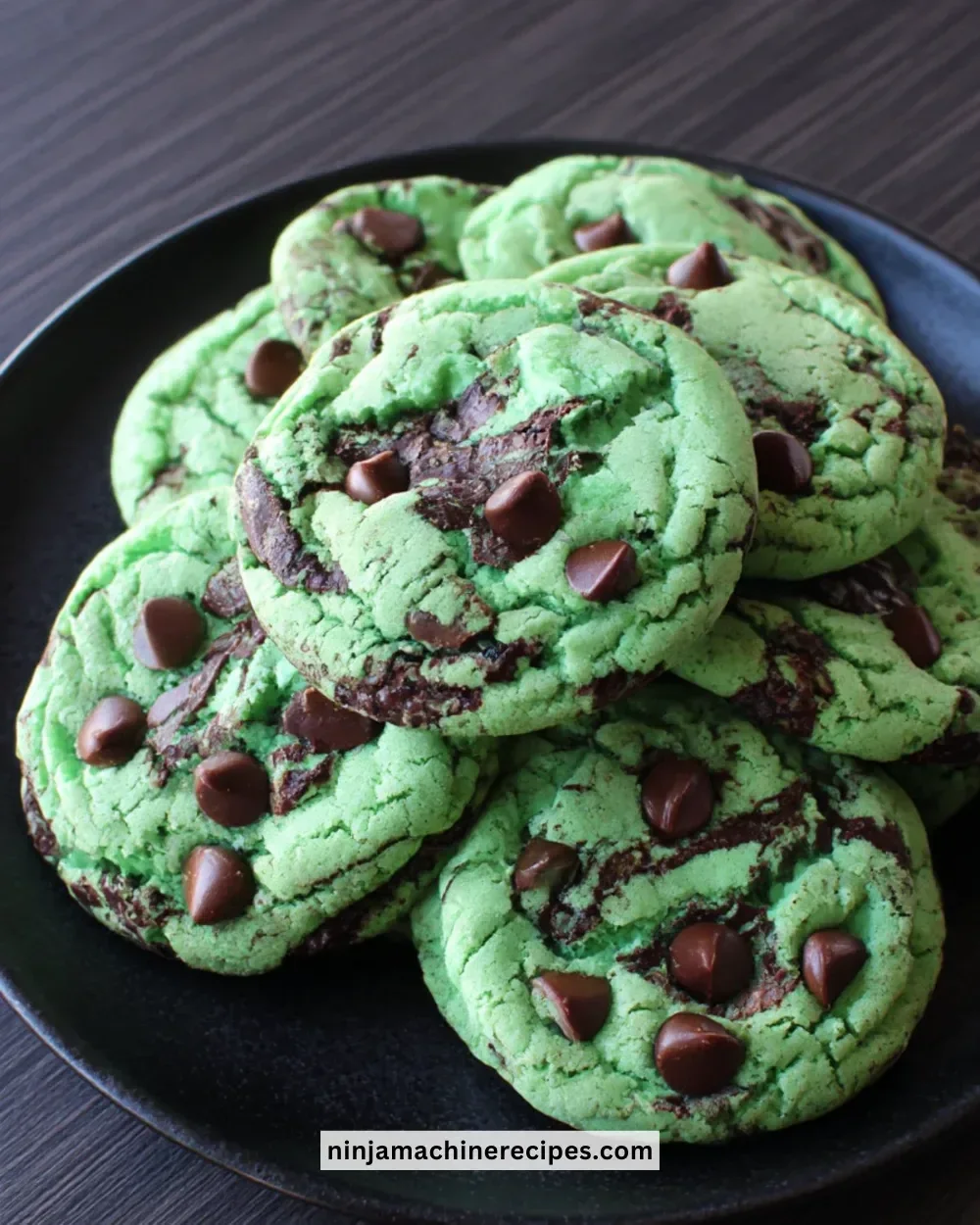 Freshly baked Mint Chocolate Chip Cookies on a cooling rack.