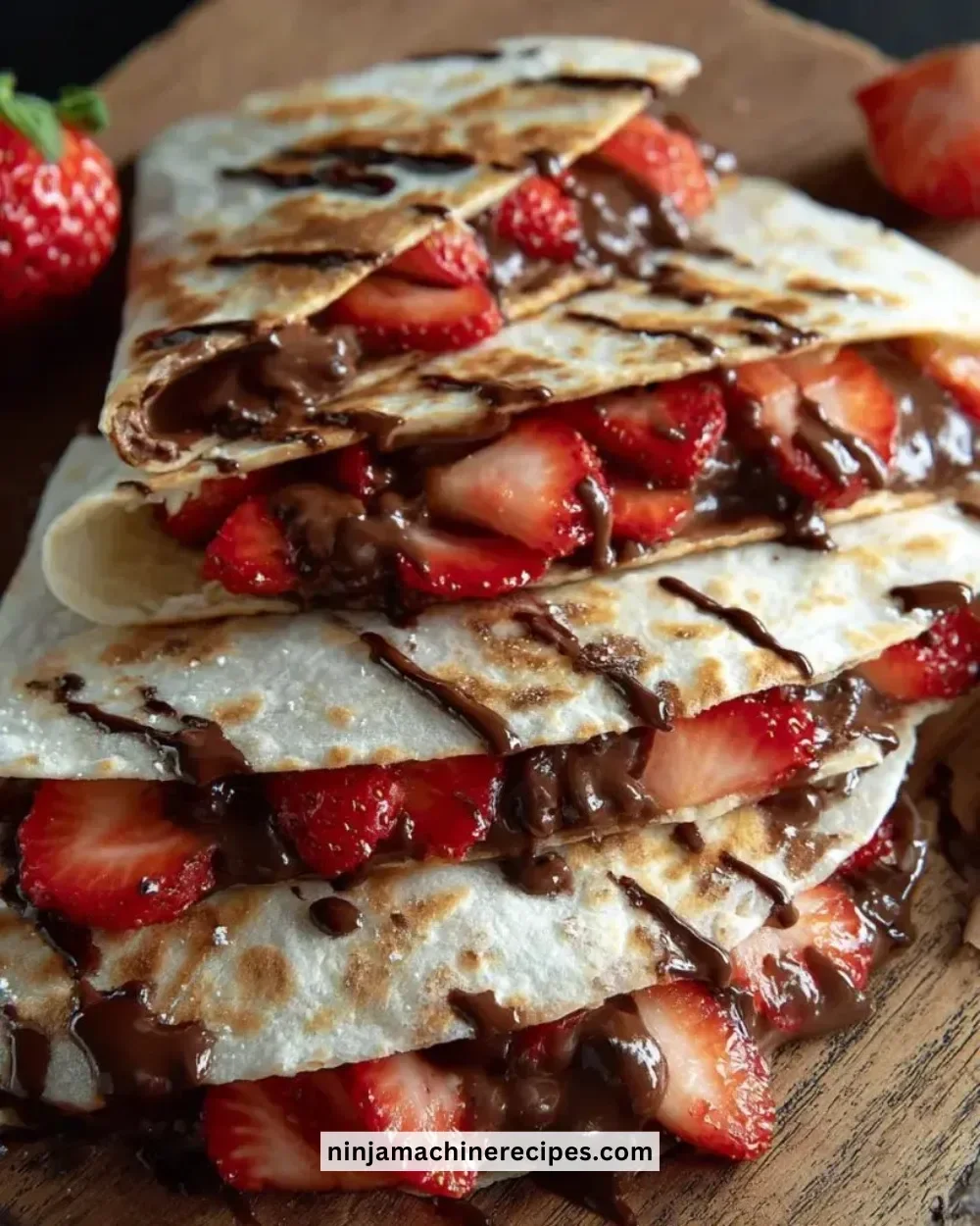 Nutella Strawberry Quesadilla served with fresh strawberries and melted chocolate