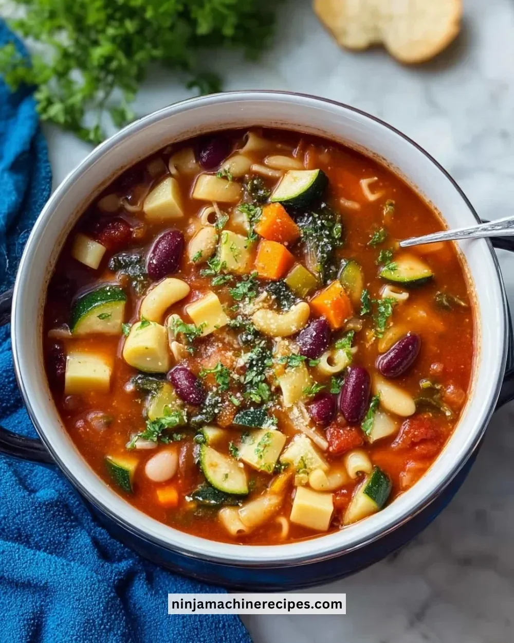 Bowl of Olive Garden Minestrone Soup with vegetables and beans