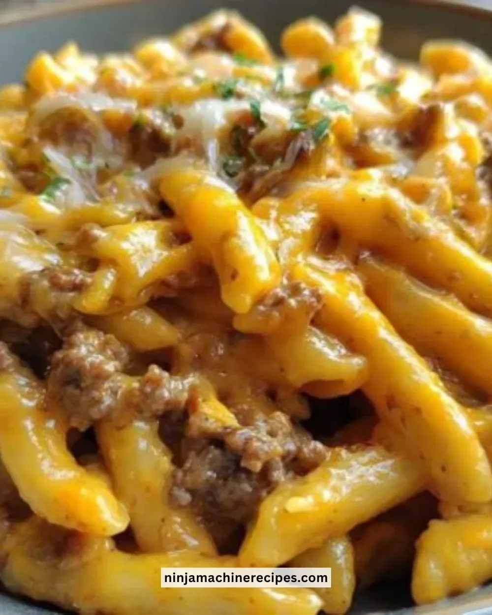 Delicious one-pot cheeseburger pasta served in a bowl with toppings.