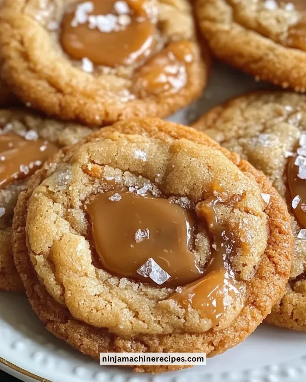 Freshly baked salted caramel cookies with a sprinkle of sea salt