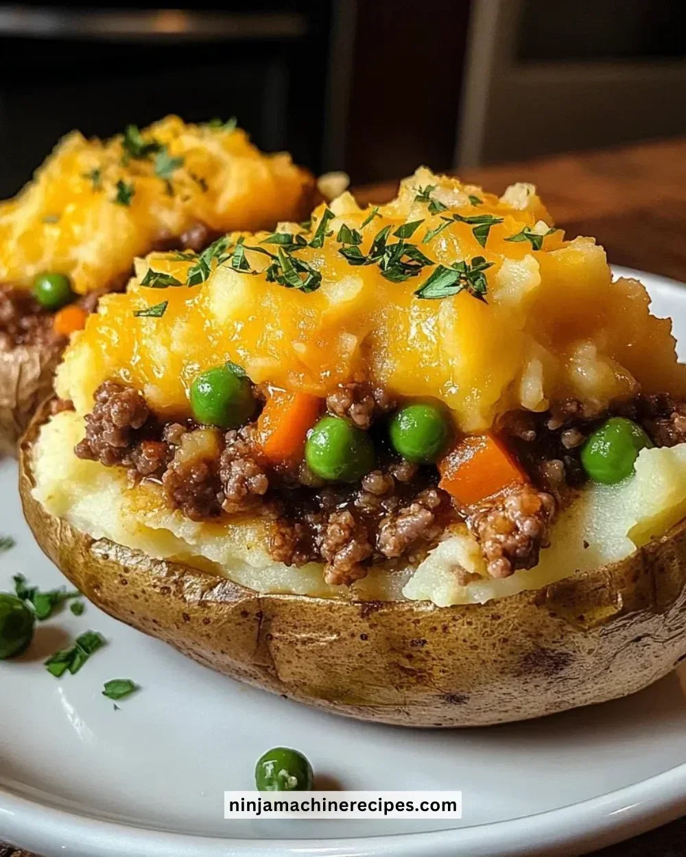 Delicious Shepherd's Pie Baked Potato topped with creamy mashed potatoes and fresh herbs
