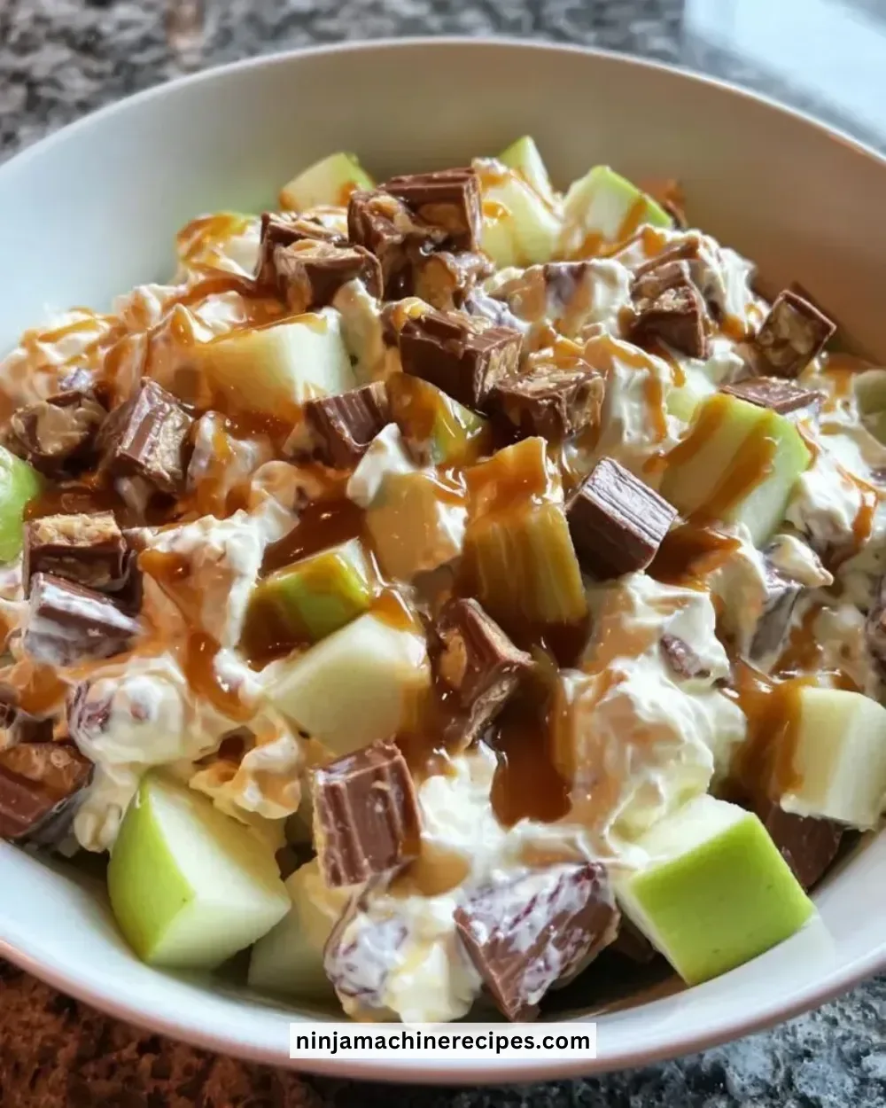 Delicious Snickers Caramel Apple Salad with apples and caramel sauce