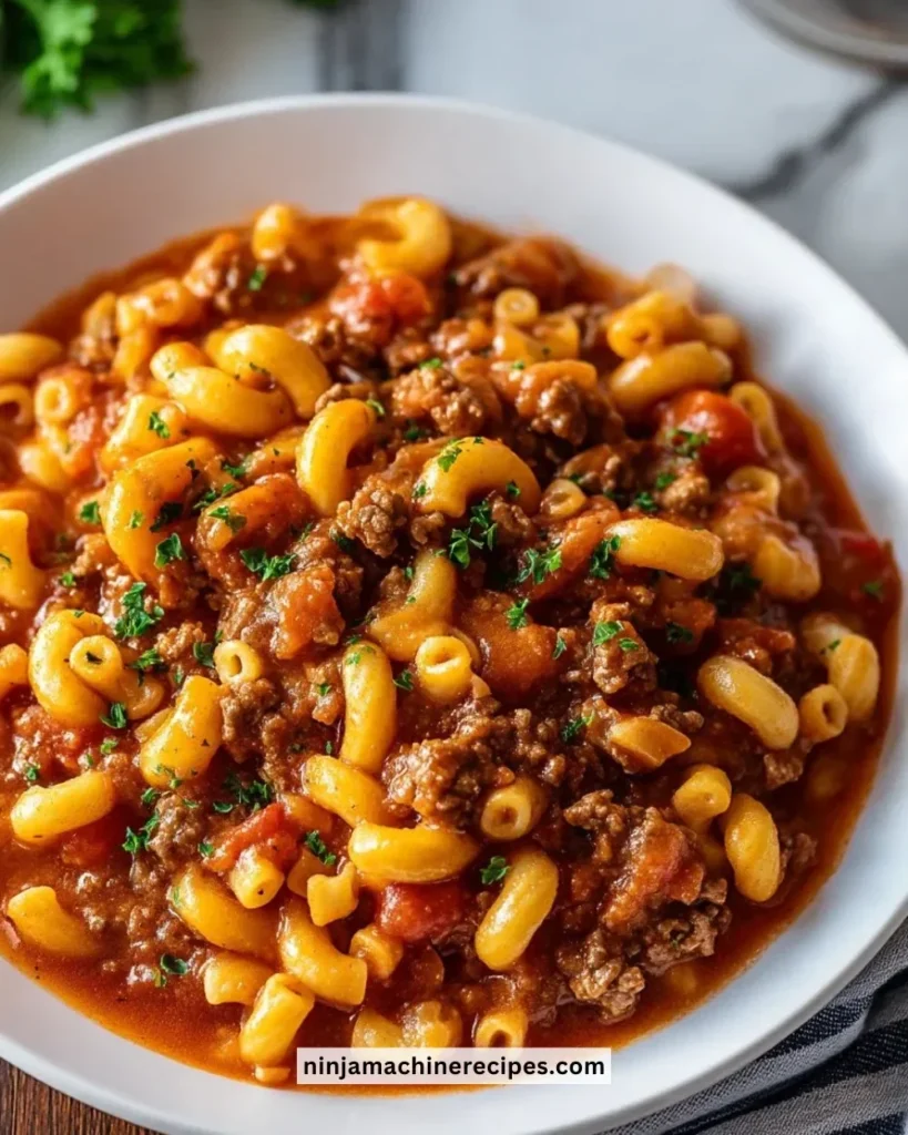 Bowl of Southern Style Goulash served with garlic bread