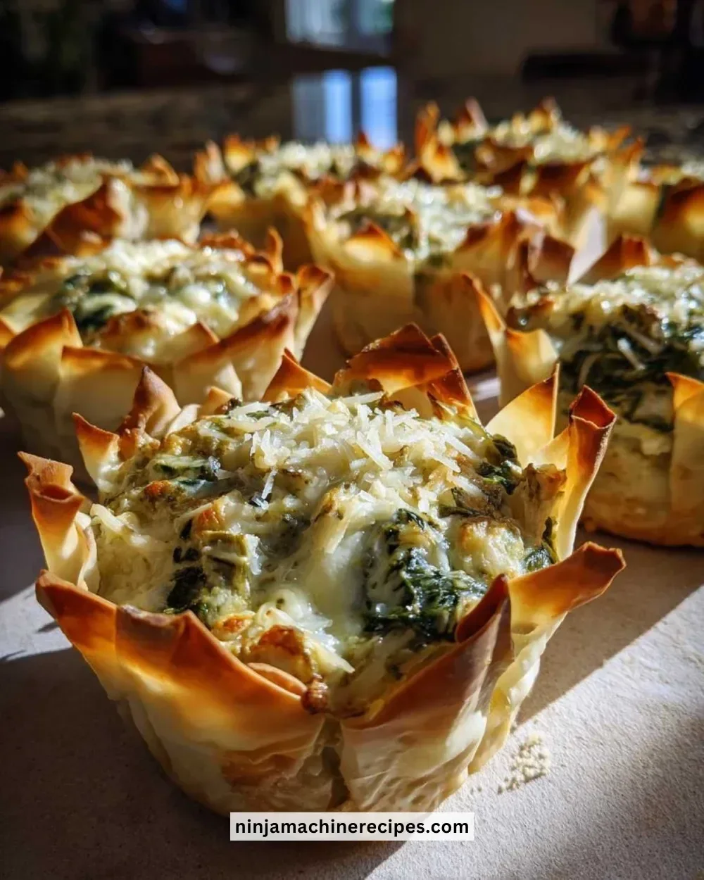 Delicious spinach artichoke bites served on a festive platter for parties.