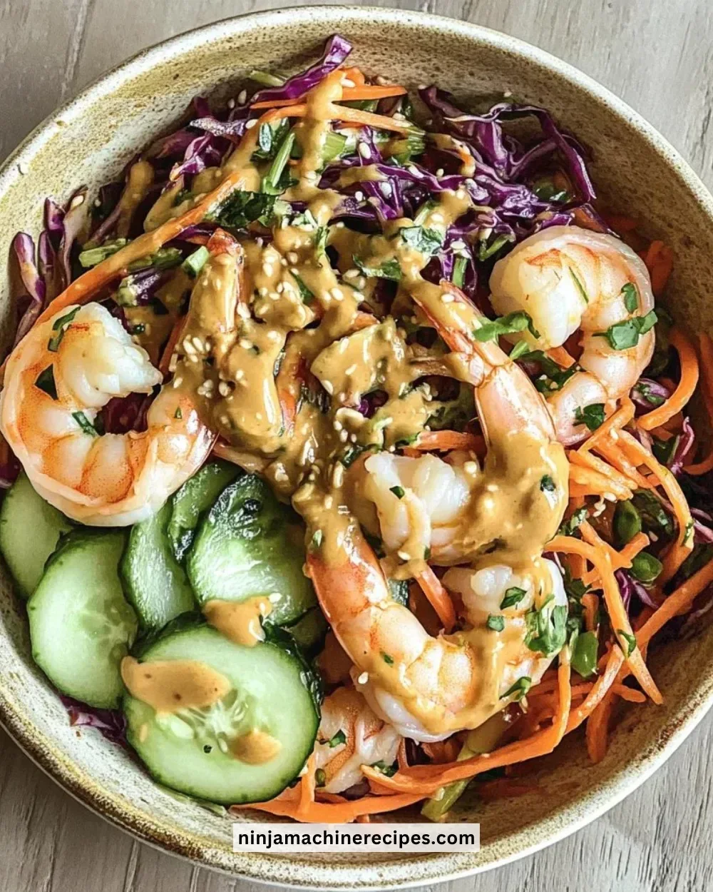 Bowl of spring roll with colorful vegetables and peanut sauce