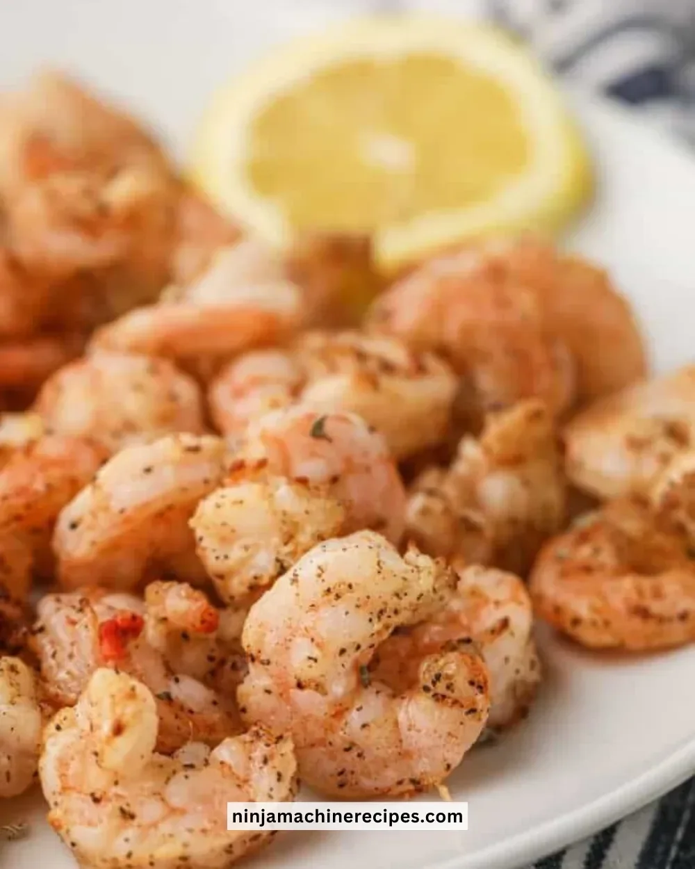 Crispy Air Fryer Shrimp served with a dipping sauce on a plate