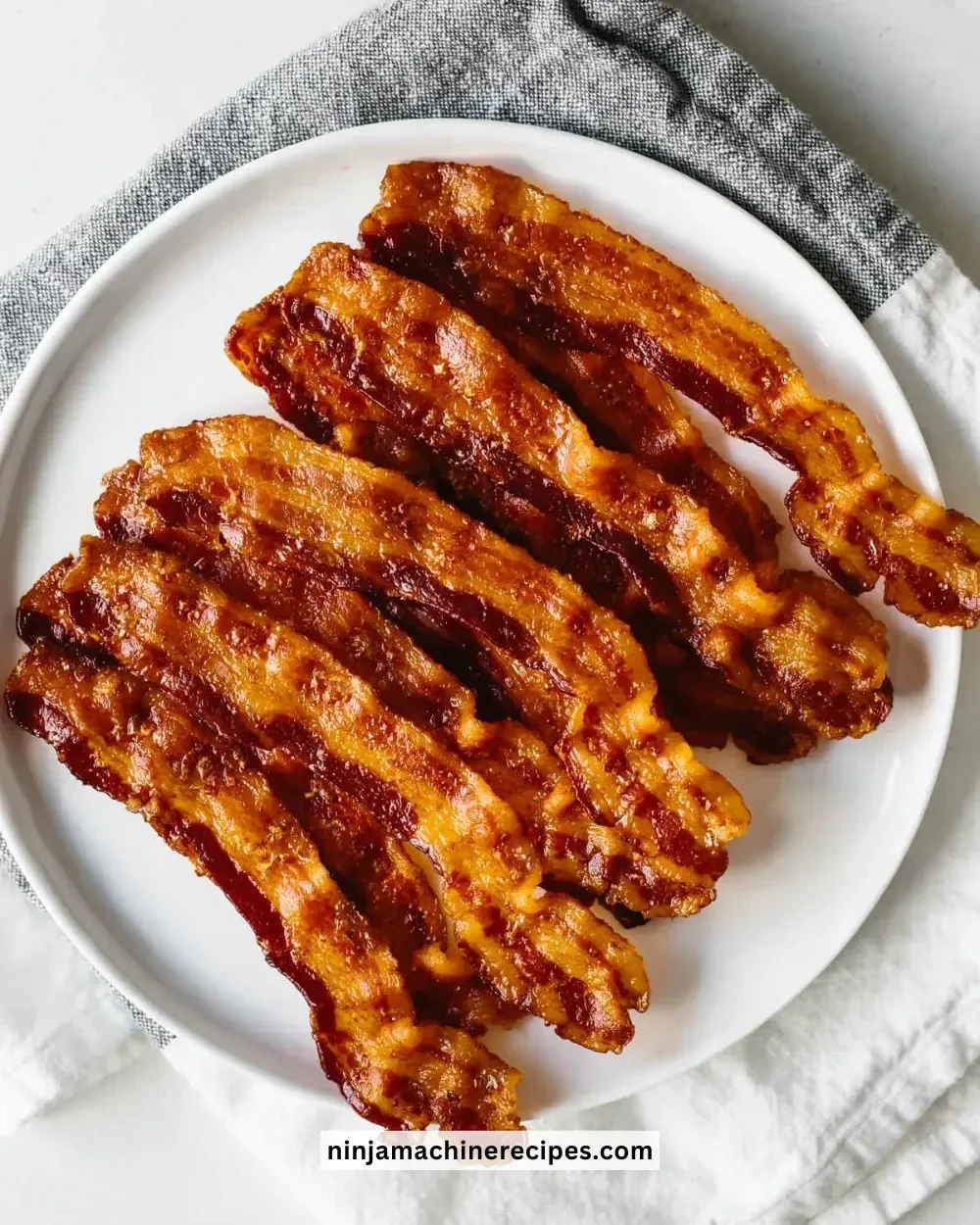 Crispy bacon cooked in the oven on a baking sheet