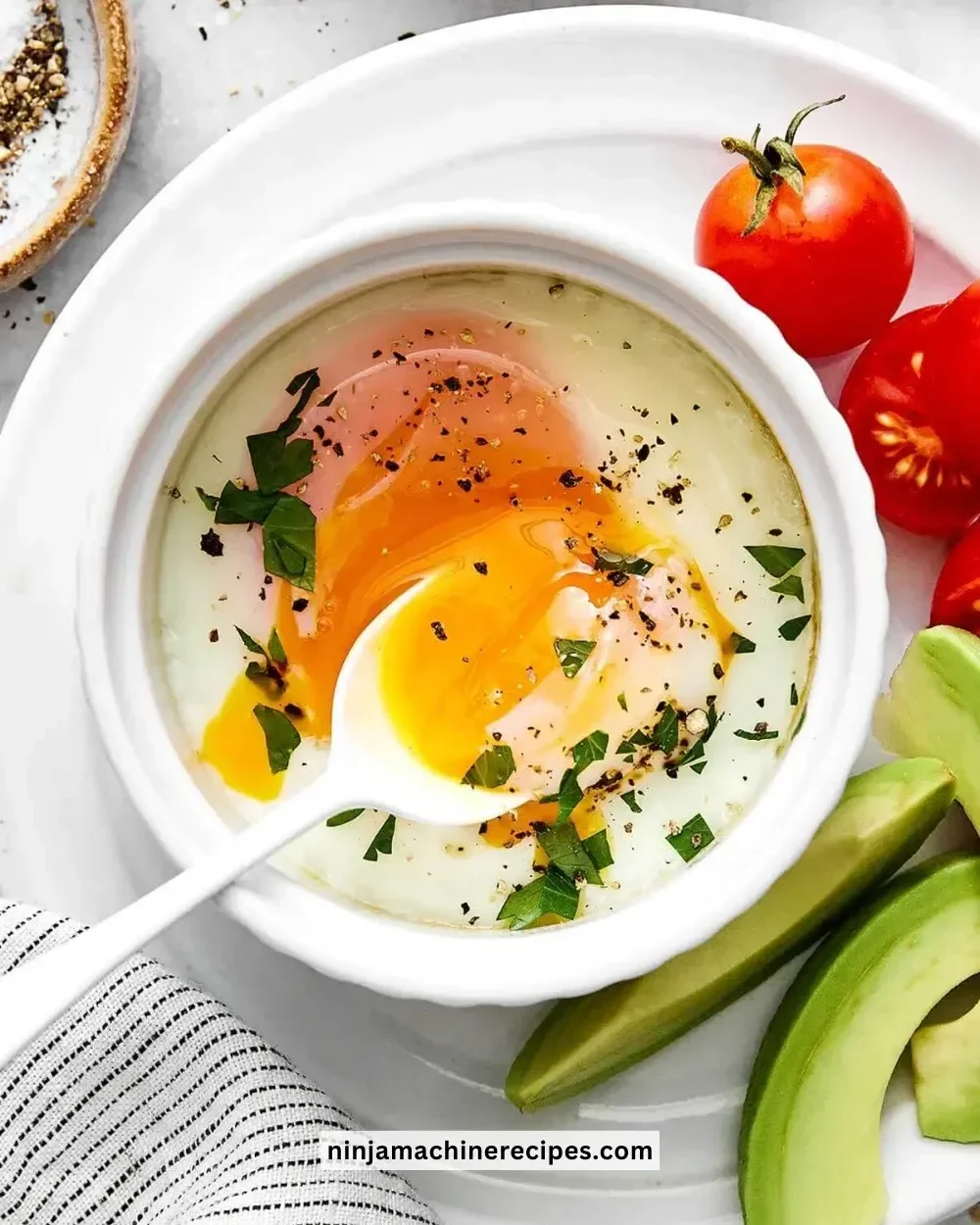Deliciously baked eggs served with fresh herbs and toppings.