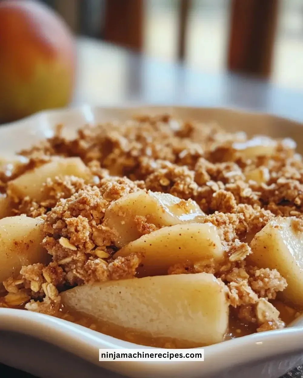 Deliciously baked maple pear oat crumble served in a warm bowl