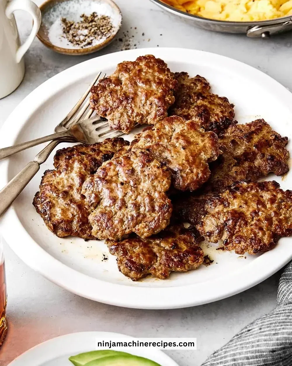 Delicious breakfast sausage served on a plate with eggs and toast.