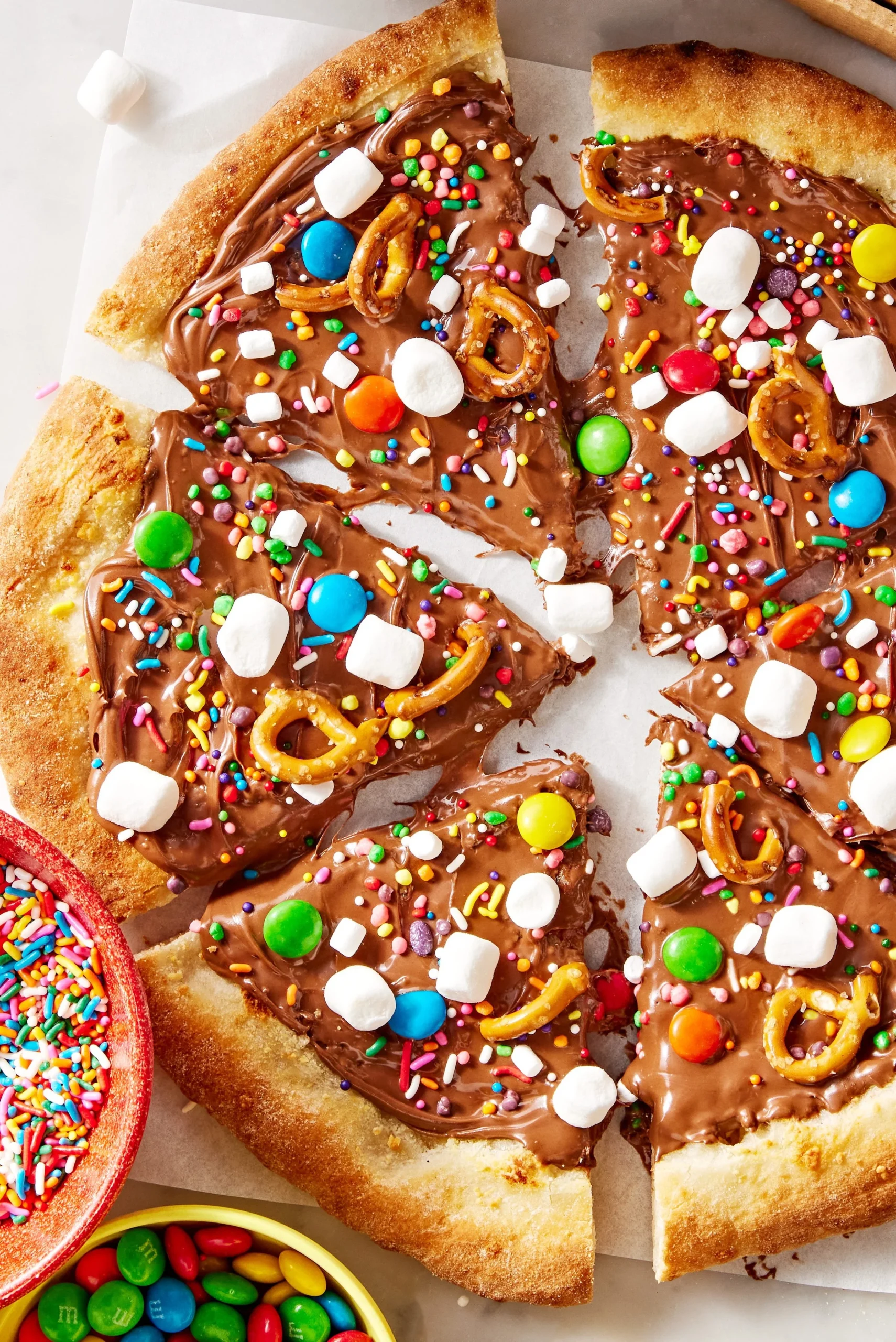 Delicious chocolate pizza topped with melted chocolate and fresh fruits.