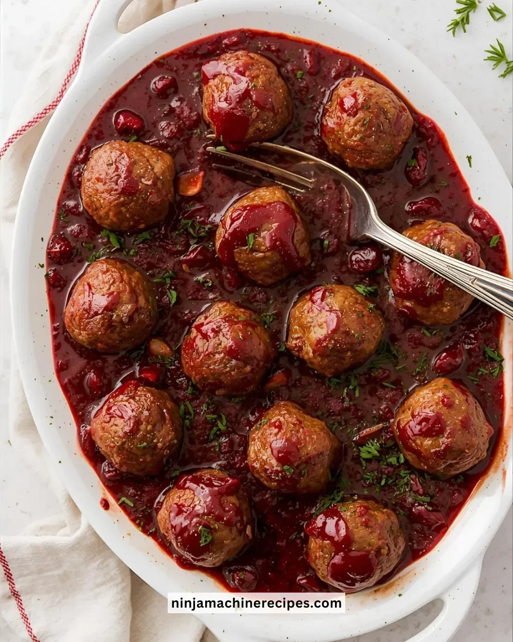 Plate of Christmas Cranberry Meatballs garnished for the holidays