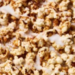 Delicious cinnamon bun popcorn in a bowl, perfect for snacking.