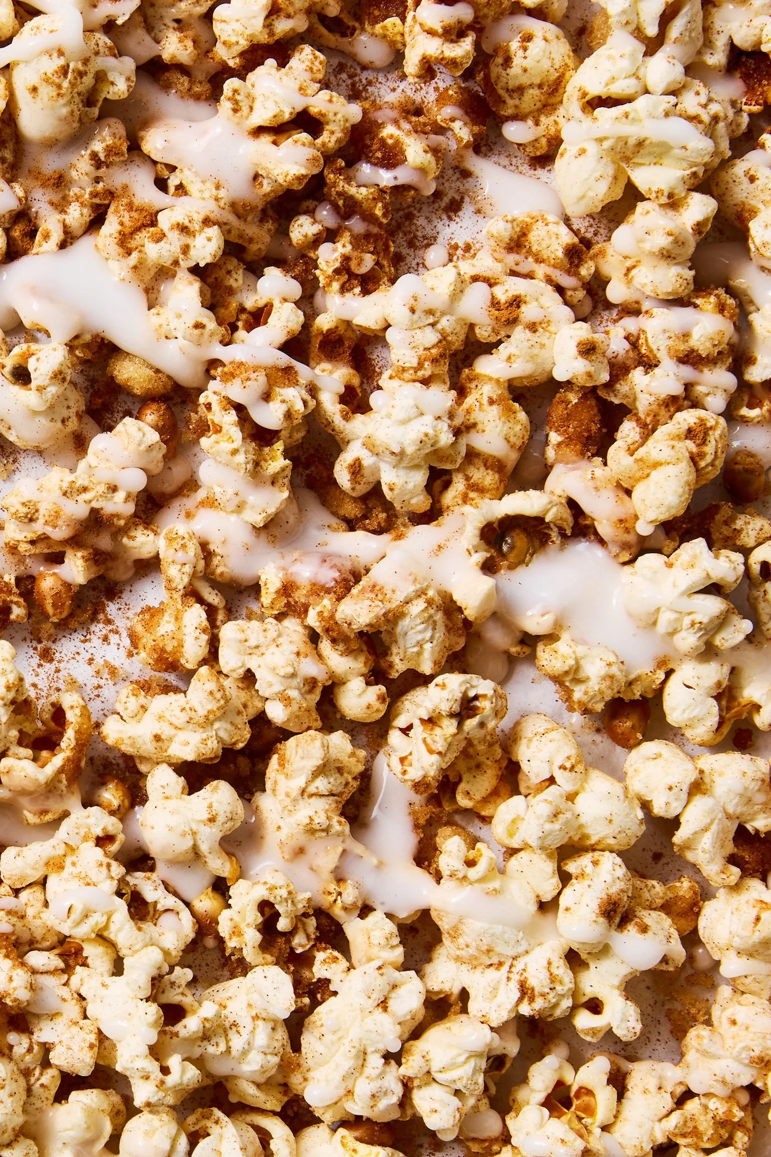 Delicious cinnamon bun popcorn in a bowl, perfect for snacking.