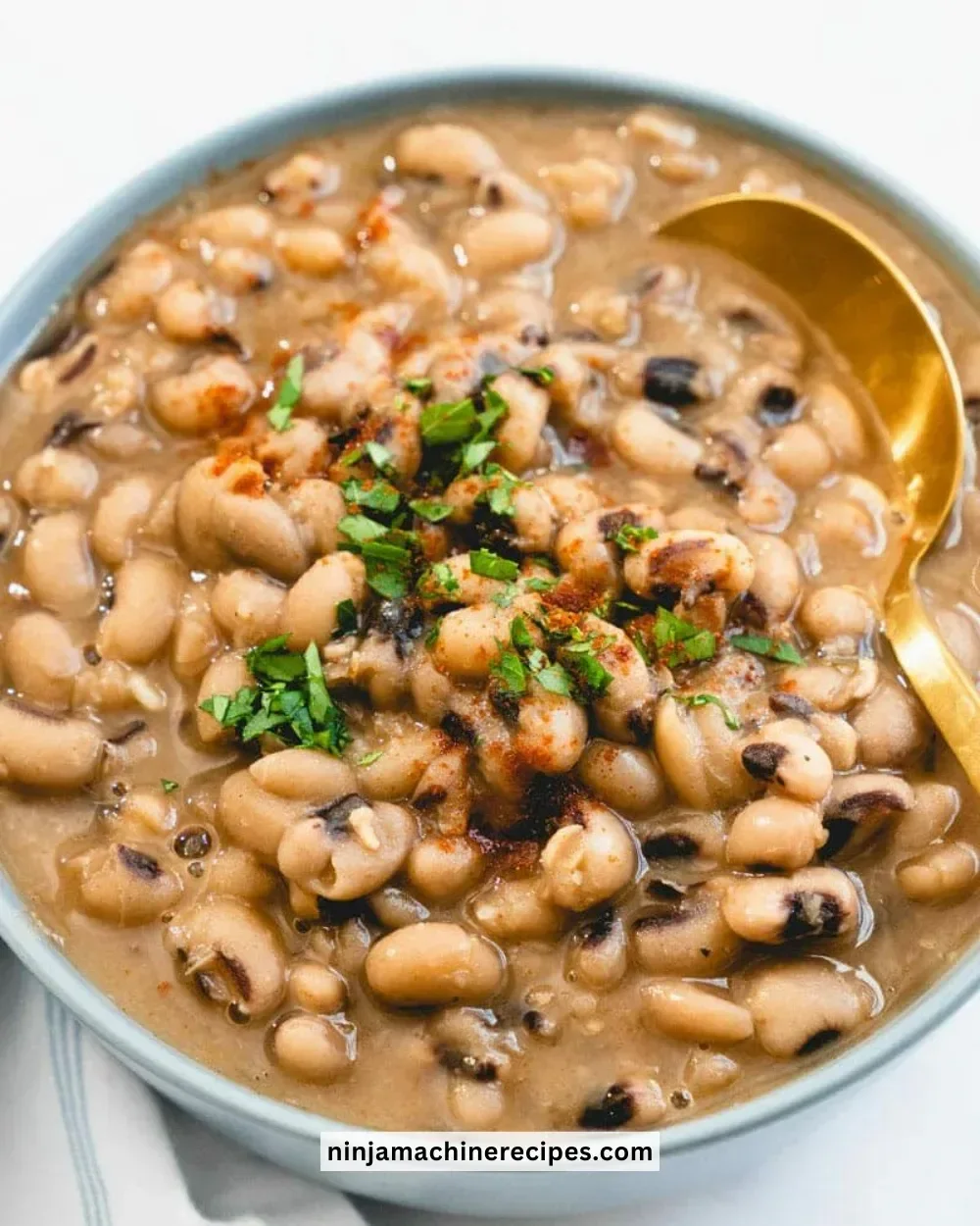 Easy Black Eyed Peas Recipe on a plate garnished with herbs