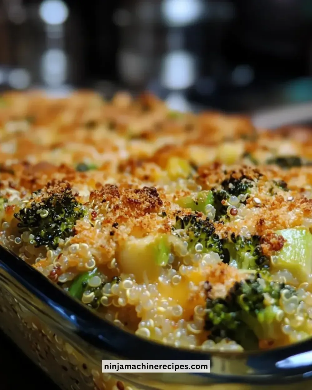 Baked broccoli cheddar quinoa dish ready to serve on a plate.