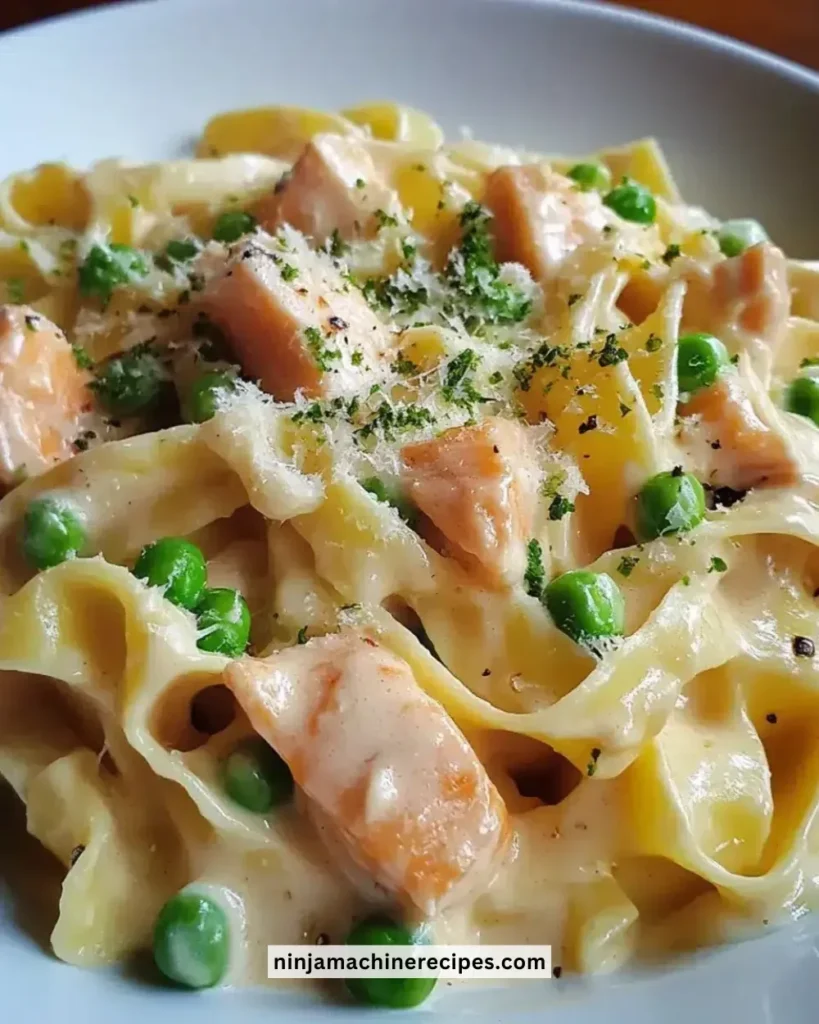 Easy creamy salmon and pea tagliatelle dish served in a bowl